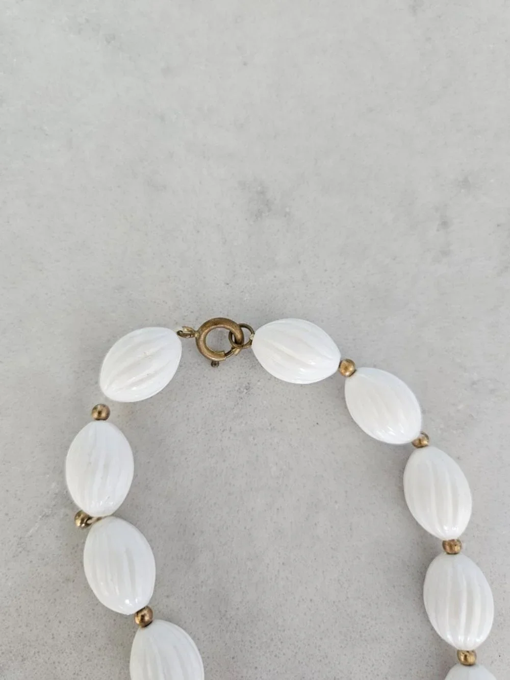 RARE AND VINTAGE WHITE RIBBED OVAL BEAD 48